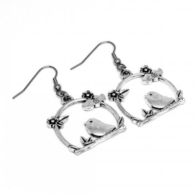 Boucles d oreilles oiseau sur son perchoir avec fleur et nuage